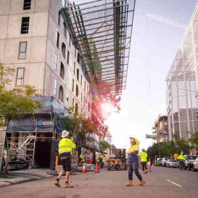 Workers at 195 Pier Street in July 2025