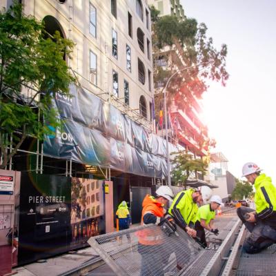 Workers at 195 Pier Street in July 2025